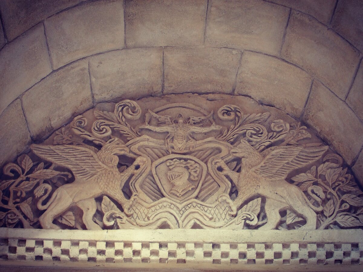 Carved relief panel with figurative and geometric motifs