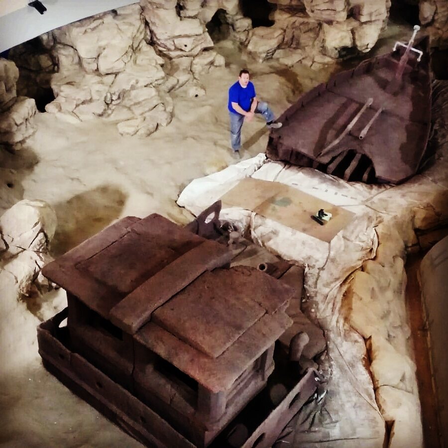 Recreated shipwreck and sunken structures on a sandy seabed at Klaipeda Aquarium, Lithuania
