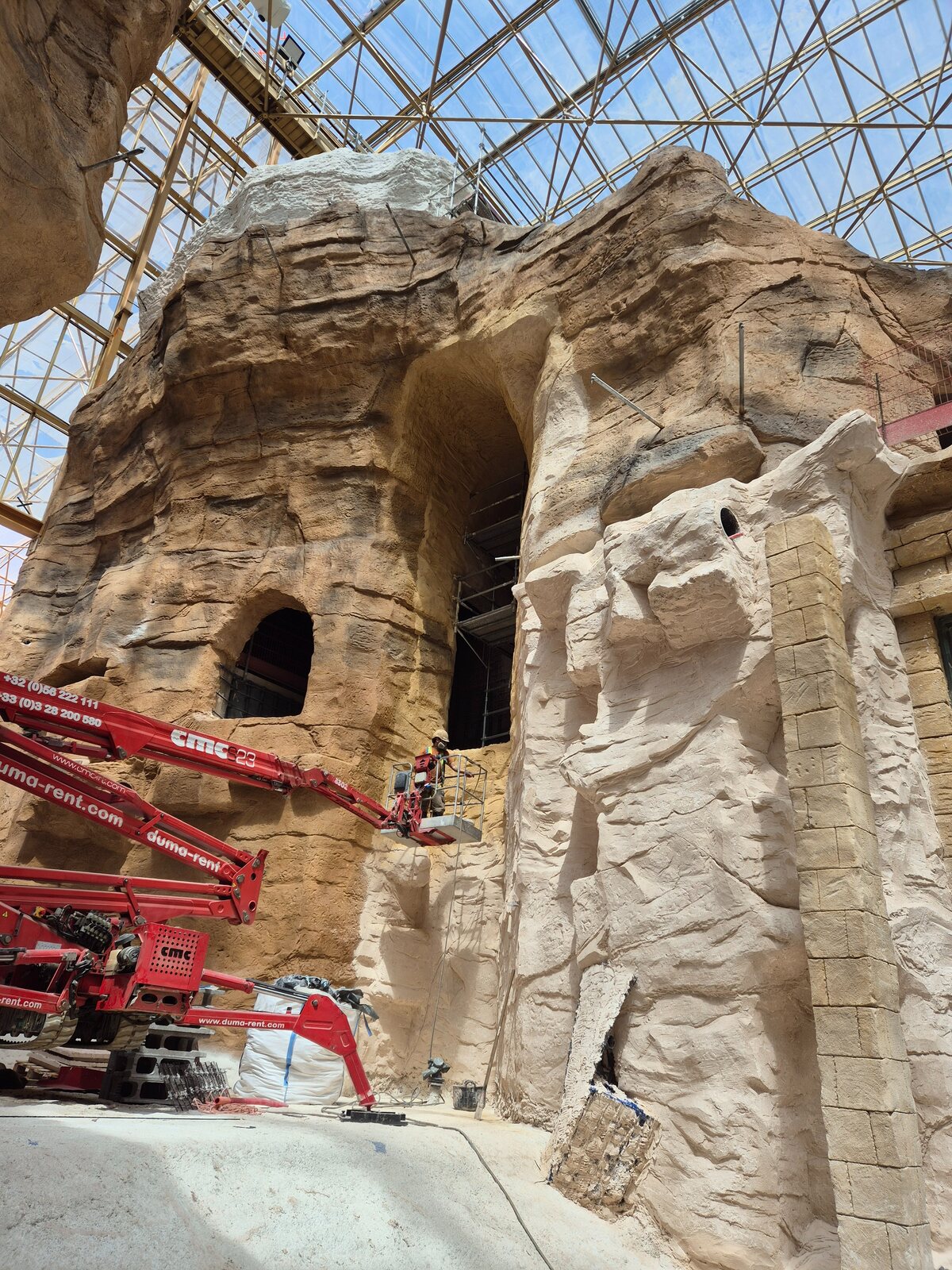 Artificial rockwork being built with the help of an elevated work platform